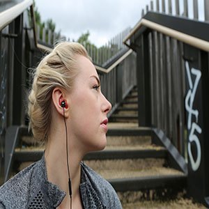 Woman wearing Wired Earphones